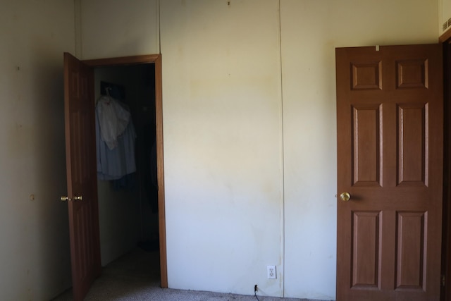 unfurnished bedroom with carpet flooring