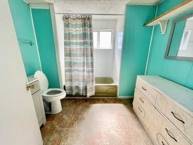 full bathroom with vanity, shower / bath combo with shower curtain, and toilet