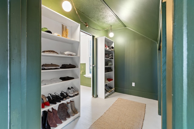 spacious closet featuring vaulted ceiling