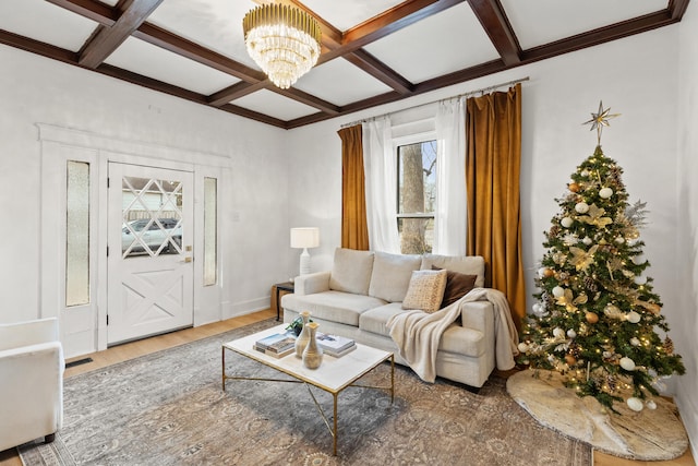 living room with beamed ceiling, a notable chandelier, wood-type flooring, and coffered ceiling