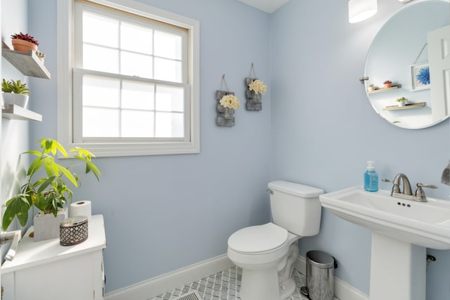 bathroom with sink, tile patterned flooring, and toilet