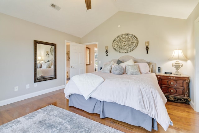 bedroom with lofted ceiling, ceiling fan, and hardwood / wood-style floors