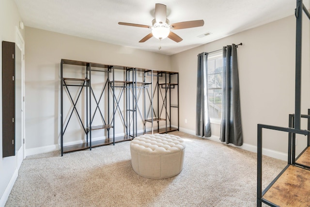 sitting room featuring ceiling fan and light carpet