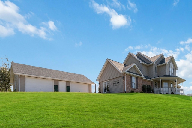 view of front of house with a garage and a front yard