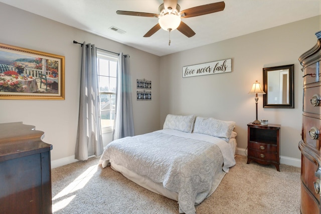 bedroom featuring ceiling fan and light colored carpet