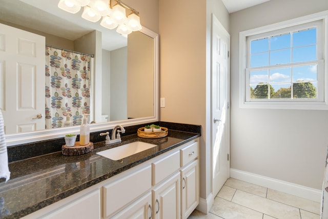 bathroom with tile patterned floors, vanity, and curtained shower