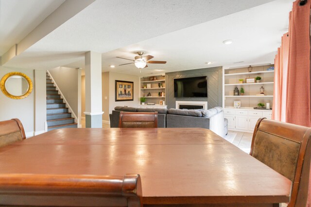 dining area with ceiling fan and built in features