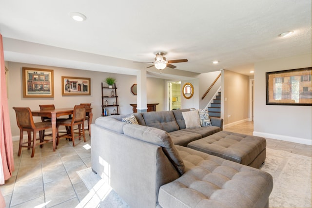 tiled living room with ceiling fan