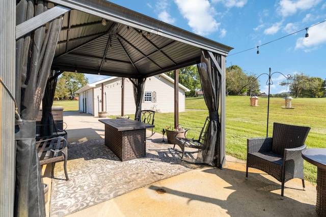 view of patio featuring a fire pit and a gazebo