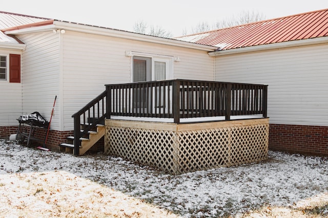 view of snow covered deck