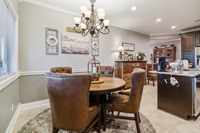 tiled dining room featuring crown molding and an inviting chandelier