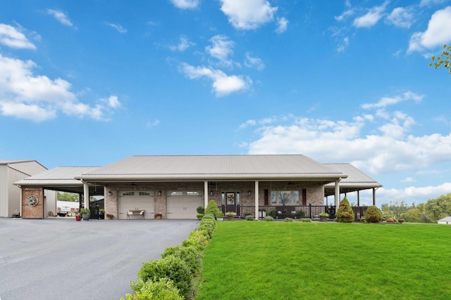 view of front of house with a front lawn, a porch, and a carport