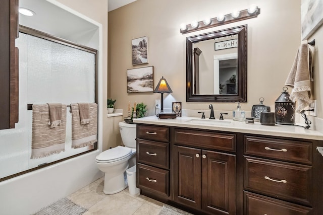 full bathroom with tile patterned flooring, shower / bath combination with glass door, vanity, and toilet