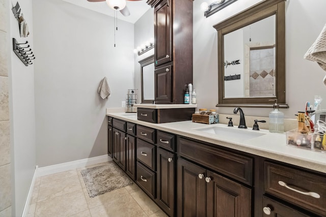 bathroom with ceiling fan, vanity, a shower, and tile patterned floors