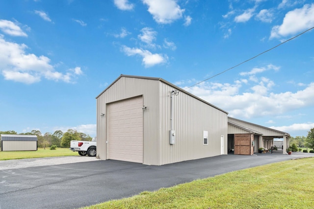 garage with a lawn