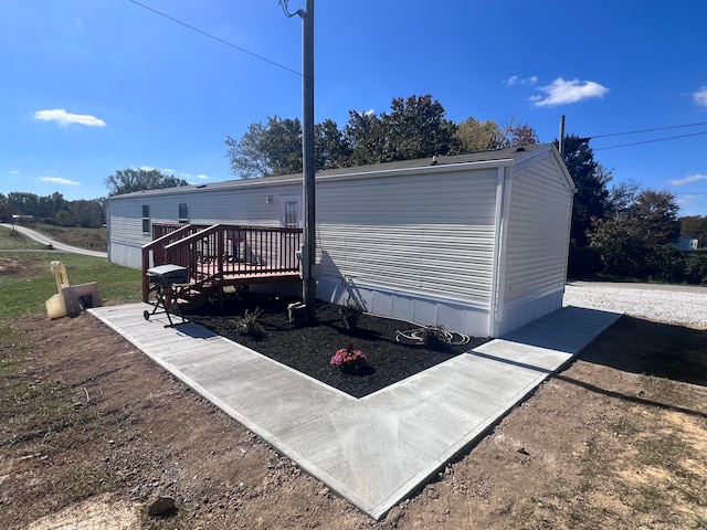 view of side of property featuring a deck