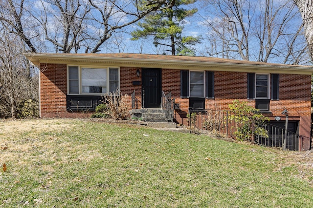 single story home with a front lawn and brick siding