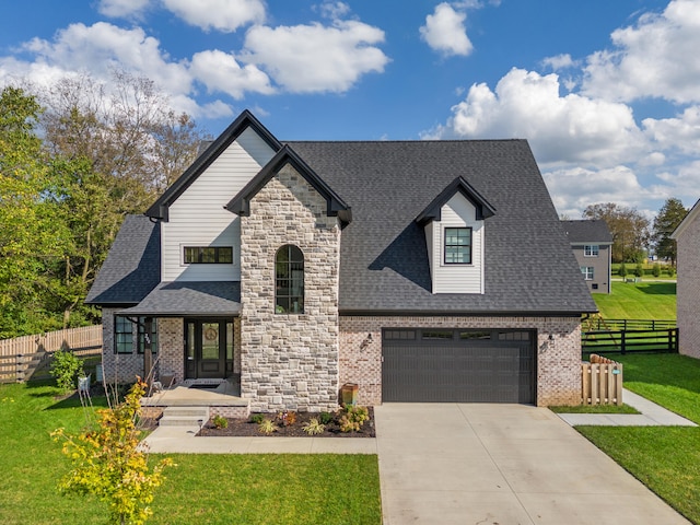 view of front of house with a garage, a shingled roof, fence, a front lawn, and brick siding