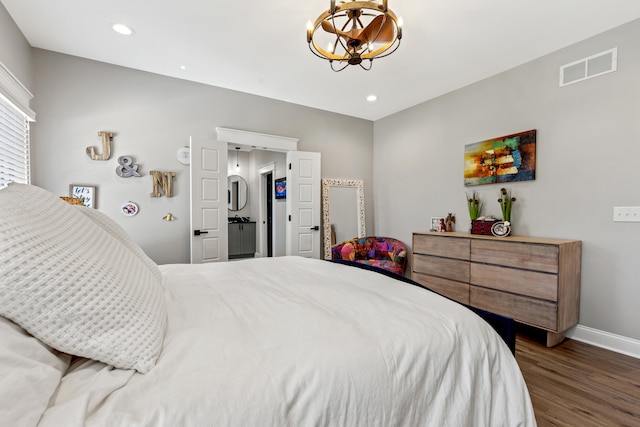 bedroom with dark wood finished floors, a notable chandelier, recessed lighting, visible vents, and baseboards