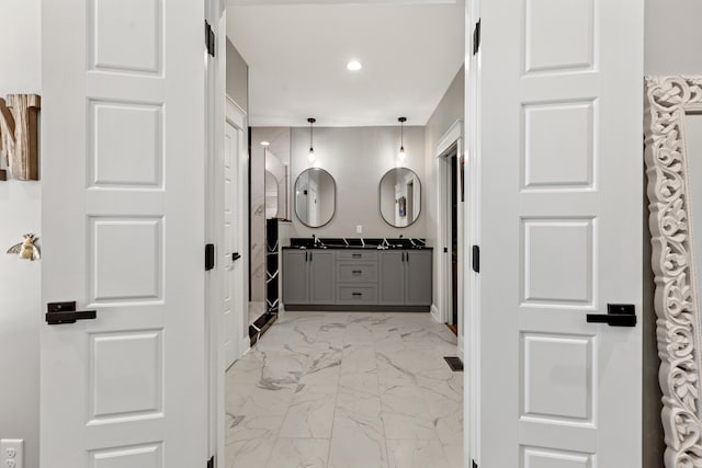 full bathroom featuring double vanity, visible vents, marble finish floor, a sink, and recessed lighting