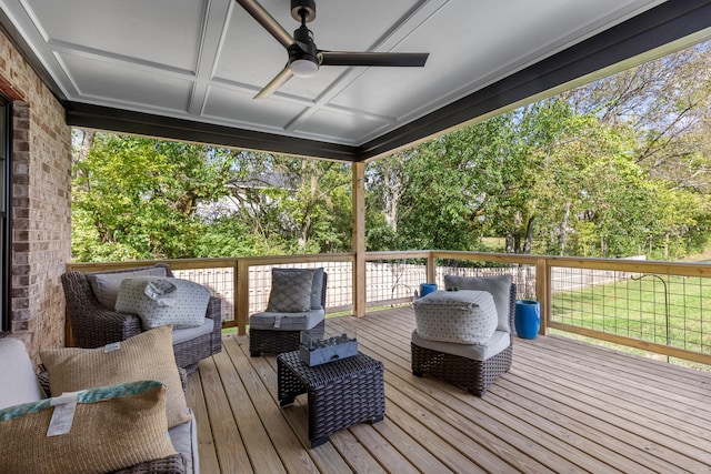 deck with outdoor lounge area and a ceiling fan