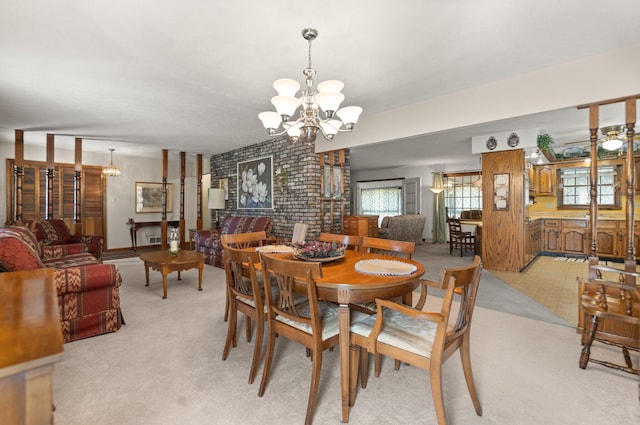 carpeted dining area with a notable chandelier