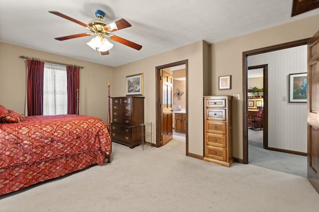 carpeted bedroom featuring a textured ceiling, ceiling fan, and ensuite bathroom