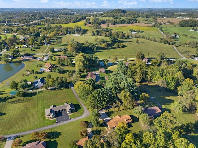 bird's eye view featuring a rural view and a water view