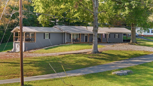 ranch-style house with a porch and a front lawn