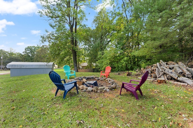 view of yard featuring an outdoor fire pit