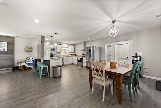 dining room featuring dark hardwood / wood-style floors and a chandelier