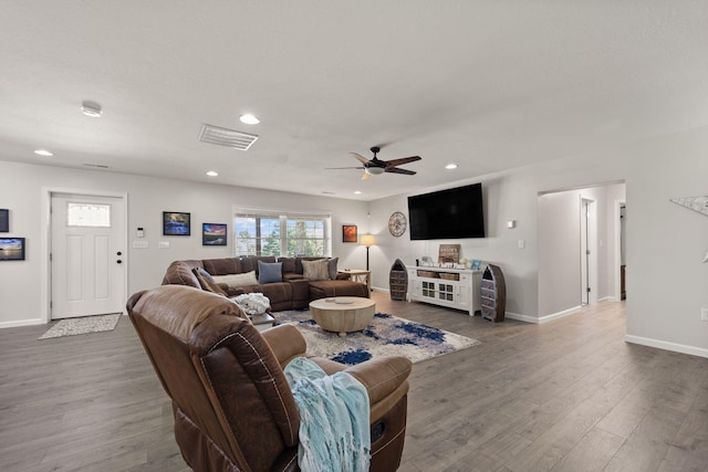 living room with hardwood / wood-style floors and ceiling fan