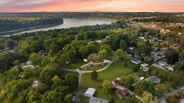 aerial view at dusk with a water view