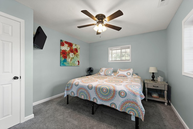 bedroom with ceiling fan and carpet