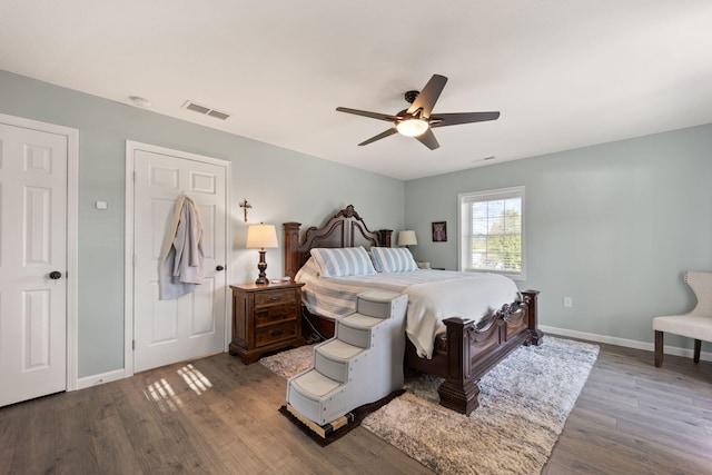 bedroom with wood-type flooring and ceiling fan