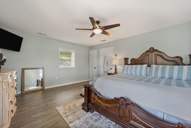 bedroom featuring dark hardwood / wood-style floors and ceiling fan