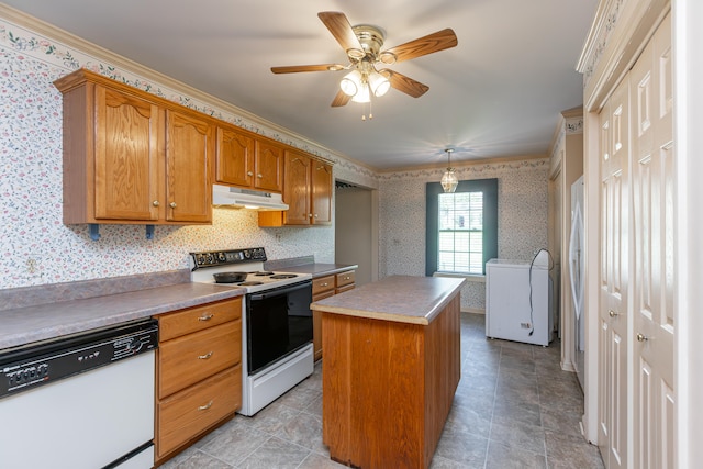 kitchen featuring crown molding, white appliances, a kitchen island, and ceiling fan