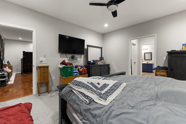 bedroom featuring ceiling fan, carpet floors, and ensuite bathroom