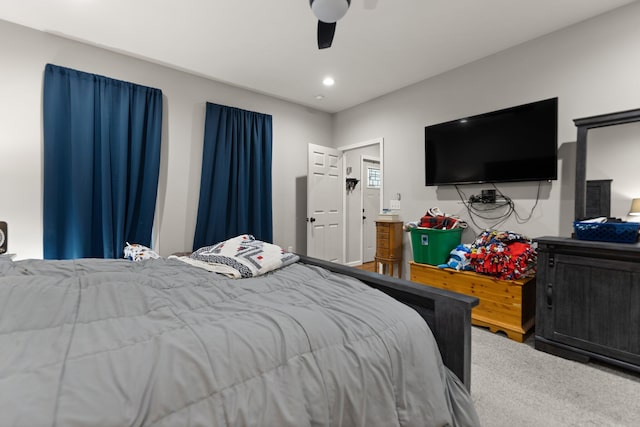 carpeted bedroom featuring ceiling fan