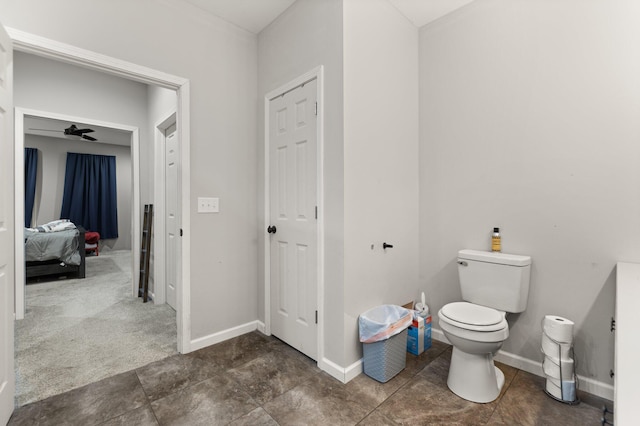 bathroom with toilet and ceiling fan