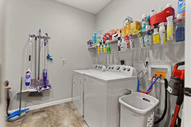 washroom featuring washer and dryer and light tile patterned floors