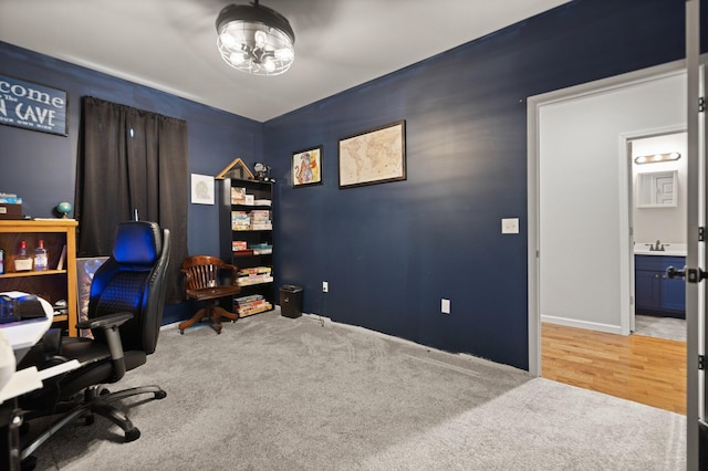 office space with carpet flooring and sink