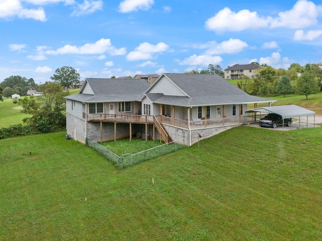 back of property featuring a lawn and a carport