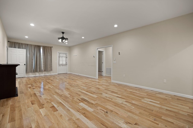 unfurnished living room featuring light hardwood / wood-style floors