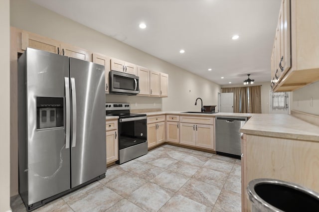 kitchen featuring light brown cabinetry, ceiling fan, sink, and stainless steel appliances