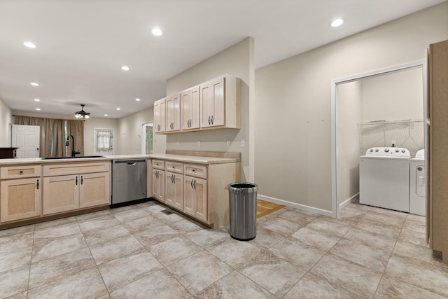 kitchen featuring light brown cabinetry, stainless steel dishwasher, ceiling fan, sink, and washing machine and dryer