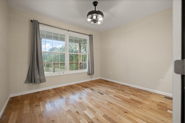 spare room with light wood-type flooring