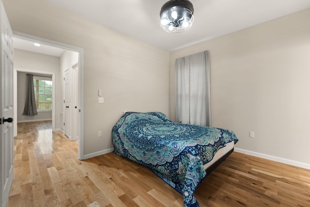 bedroom with hardwood / wood-style floors