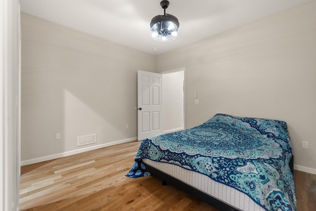 bedroom featuring hardwood / wood-style flooring