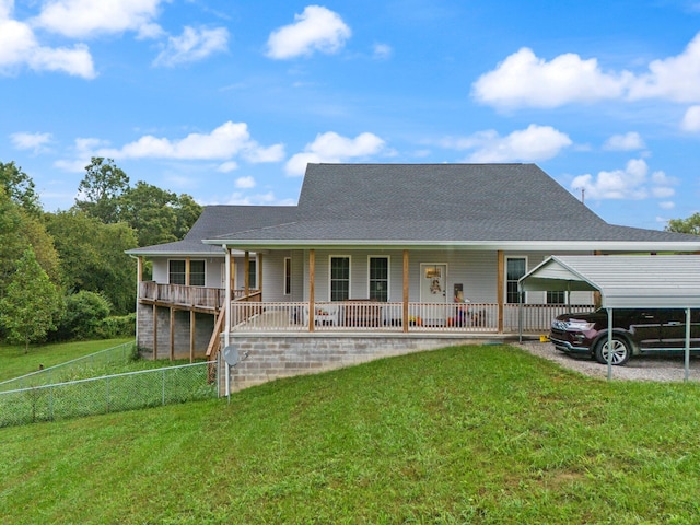 farmhouse-style home with a front lawn, a porch, and a carport